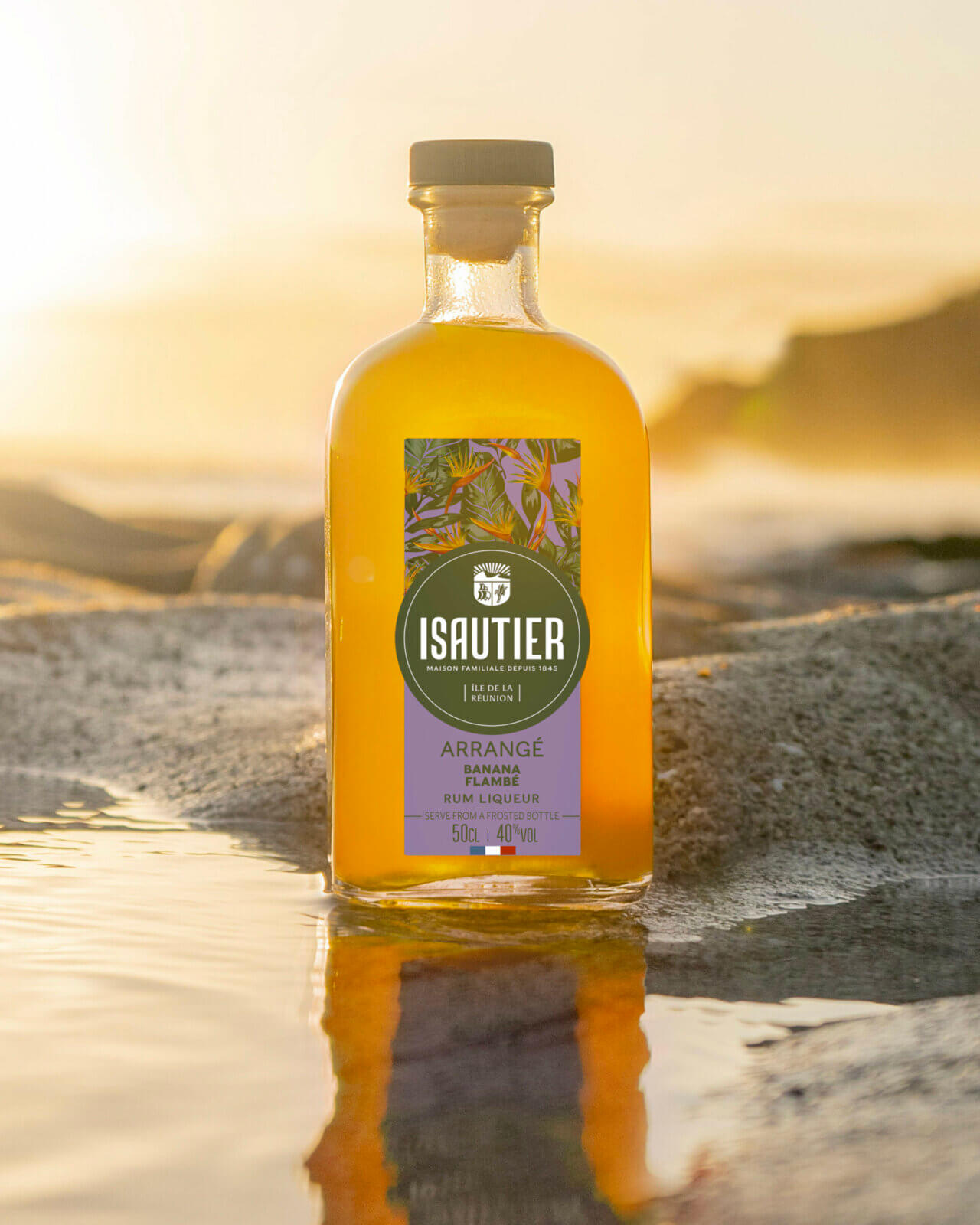 Isautier banana flambée arranged rum bottle in a warm tasting atmosphere