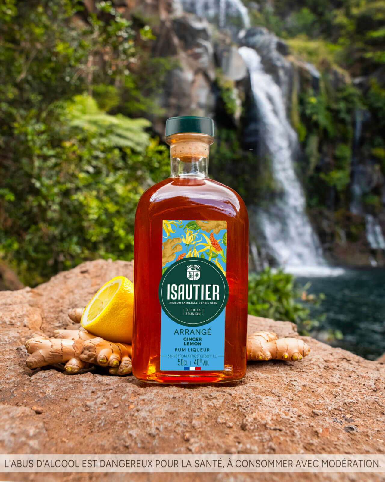 Isautier ginger lemon arranged rum bottle in a natural tropical setting